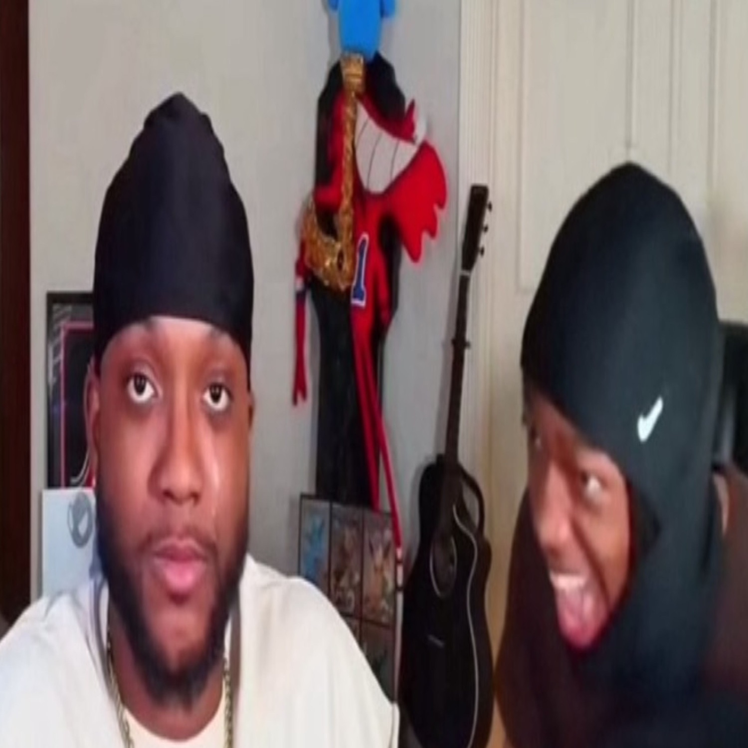 Two guys reacting, one staring blankly deadpan while the other cracks up beside him