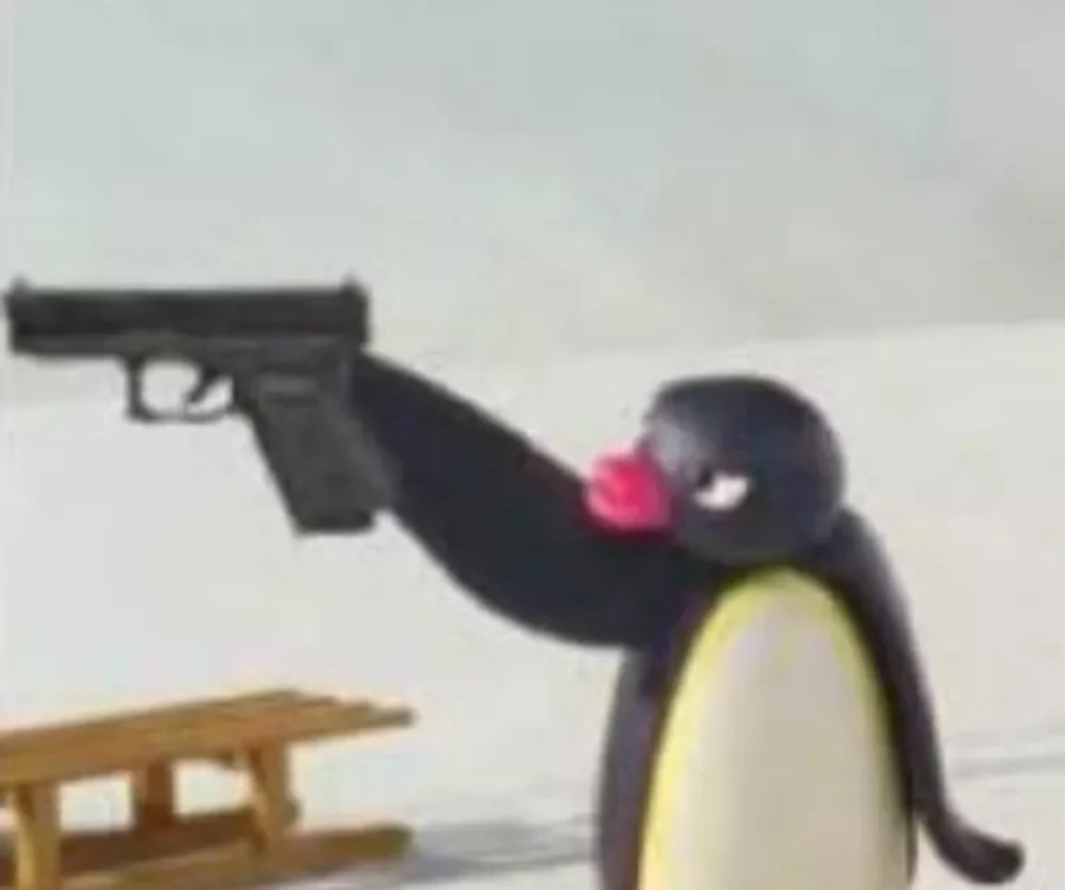 Pingu the penguin aiming a handgun straight at the camera