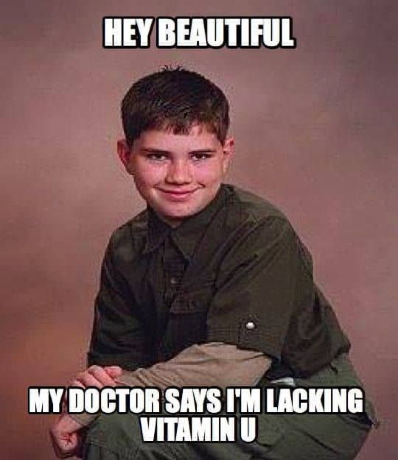 Awkward school photo boy with a sly smile captioned 'Hey beautiful, my doctor says I'm lacking Vitamin U'