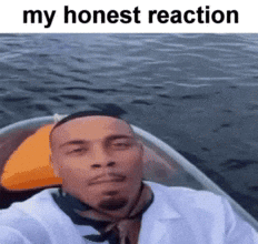 Man on a boat turning to the camera with a deadpan look, "my honest reaction"