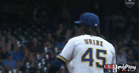 Brewers pitcher Uribe celebrating on the mound after a strikeout