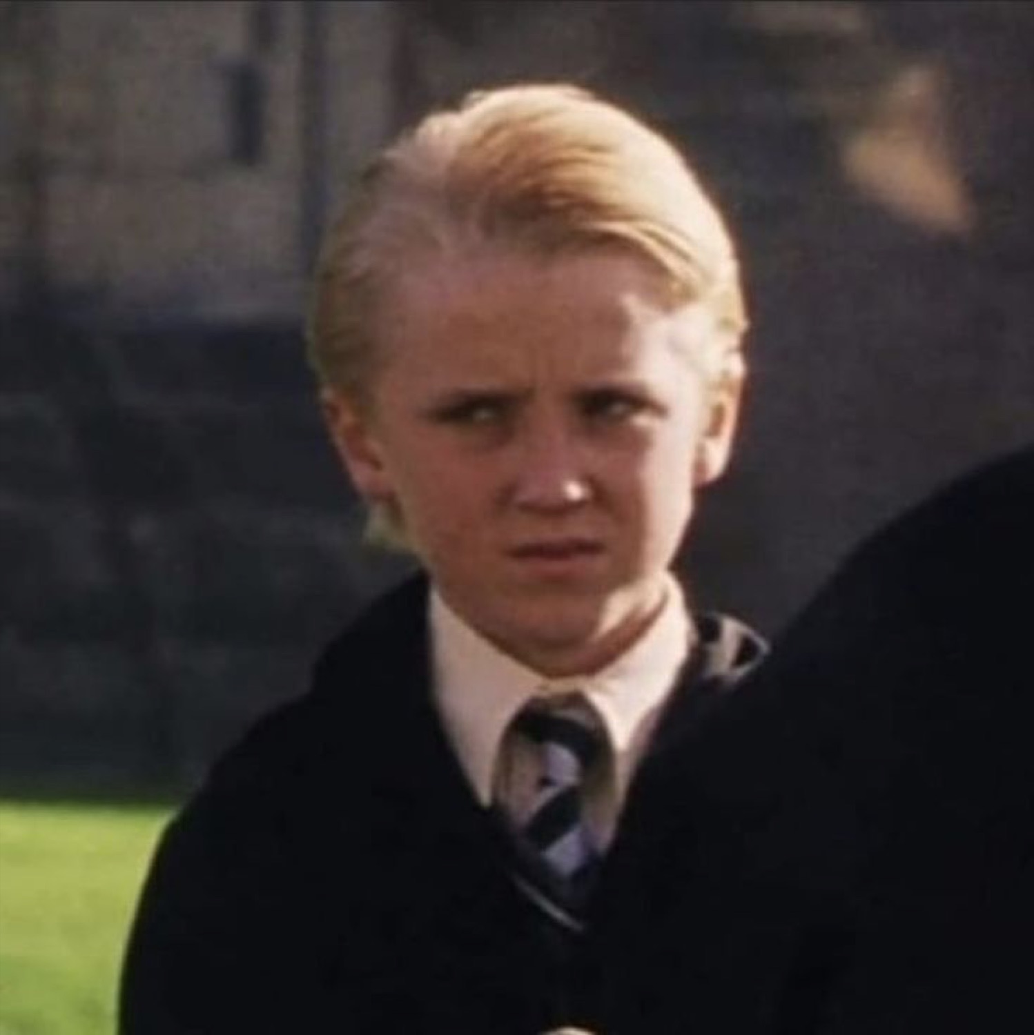 Young Draco Malfoy glaring suspiciously