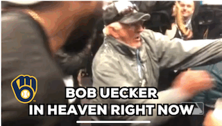 Crowd celebrating with the caption "Bob Uecker in heaven right now"