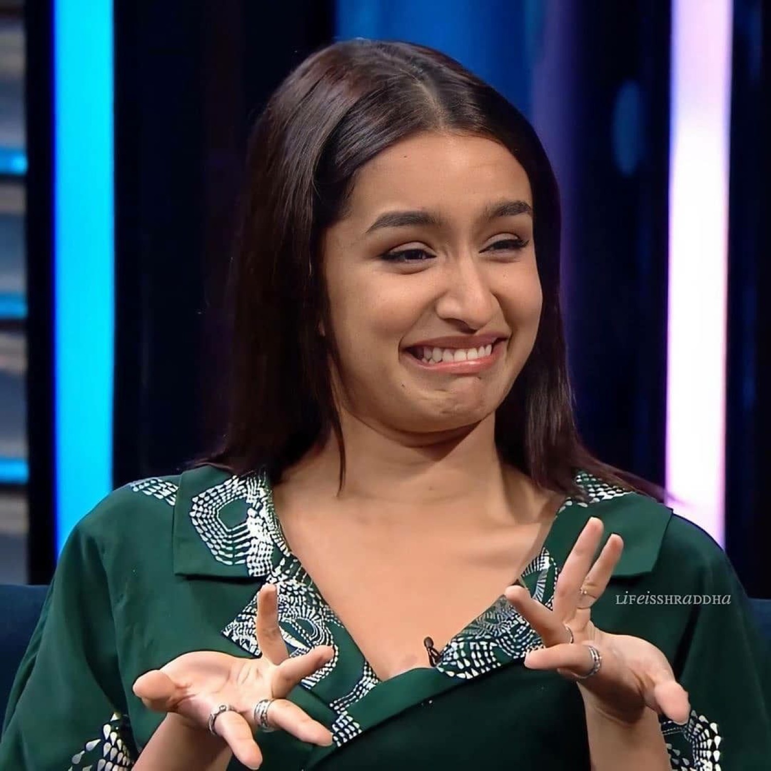 Shraddha Kapoor laughing awkwardly with her hands up