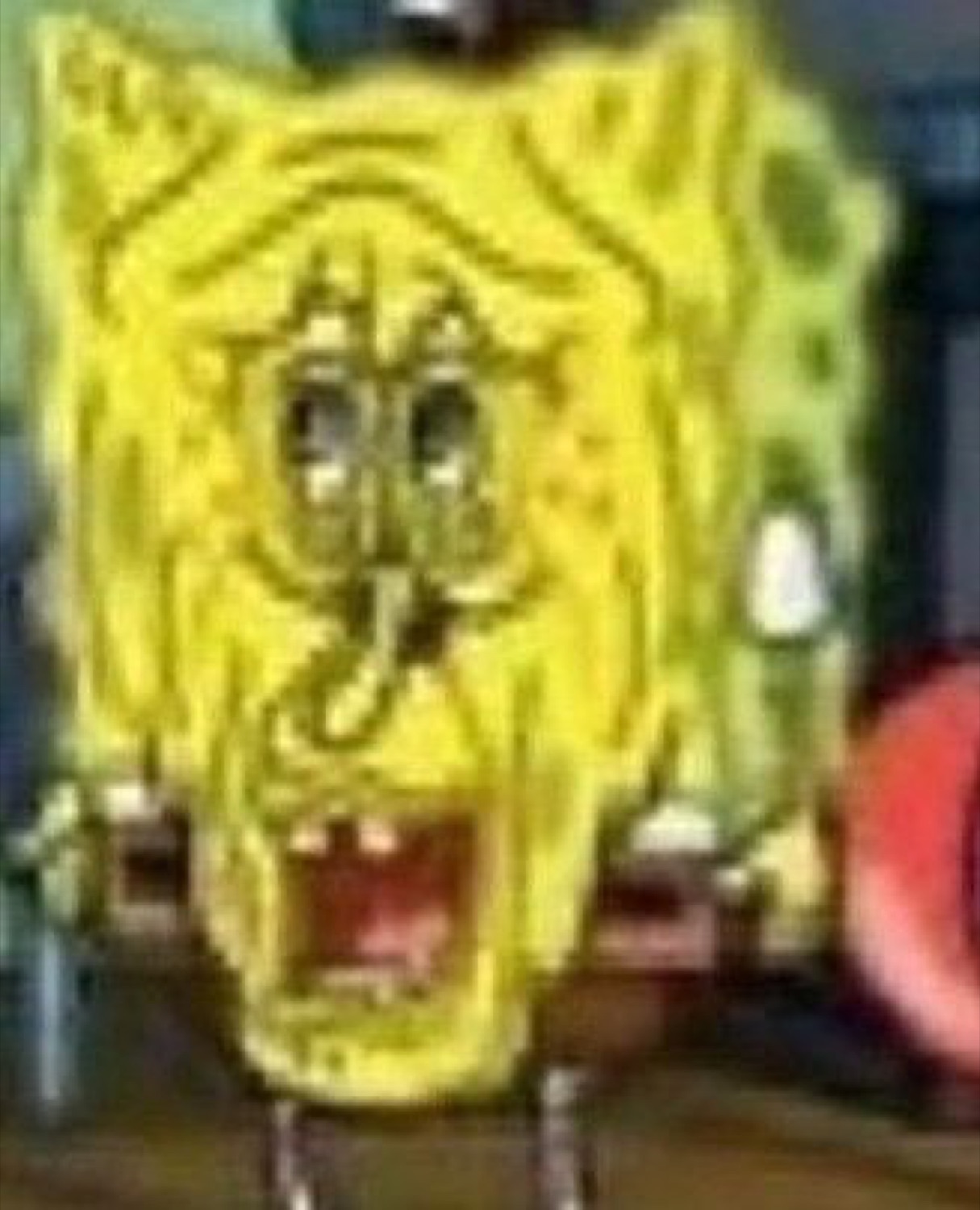 Melted, distorted SpongeBob screaming in a low-quality frame