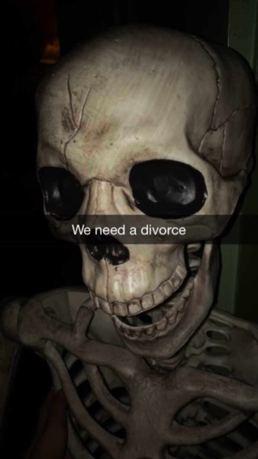 Close-up skull on a Snapchat captioned 'We need a divorce'