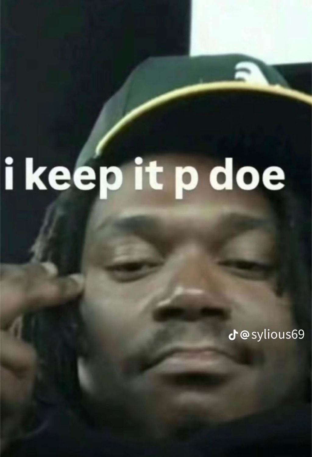 Guy squinting into the camera with a finger to his temple: 'i keep it p doe'