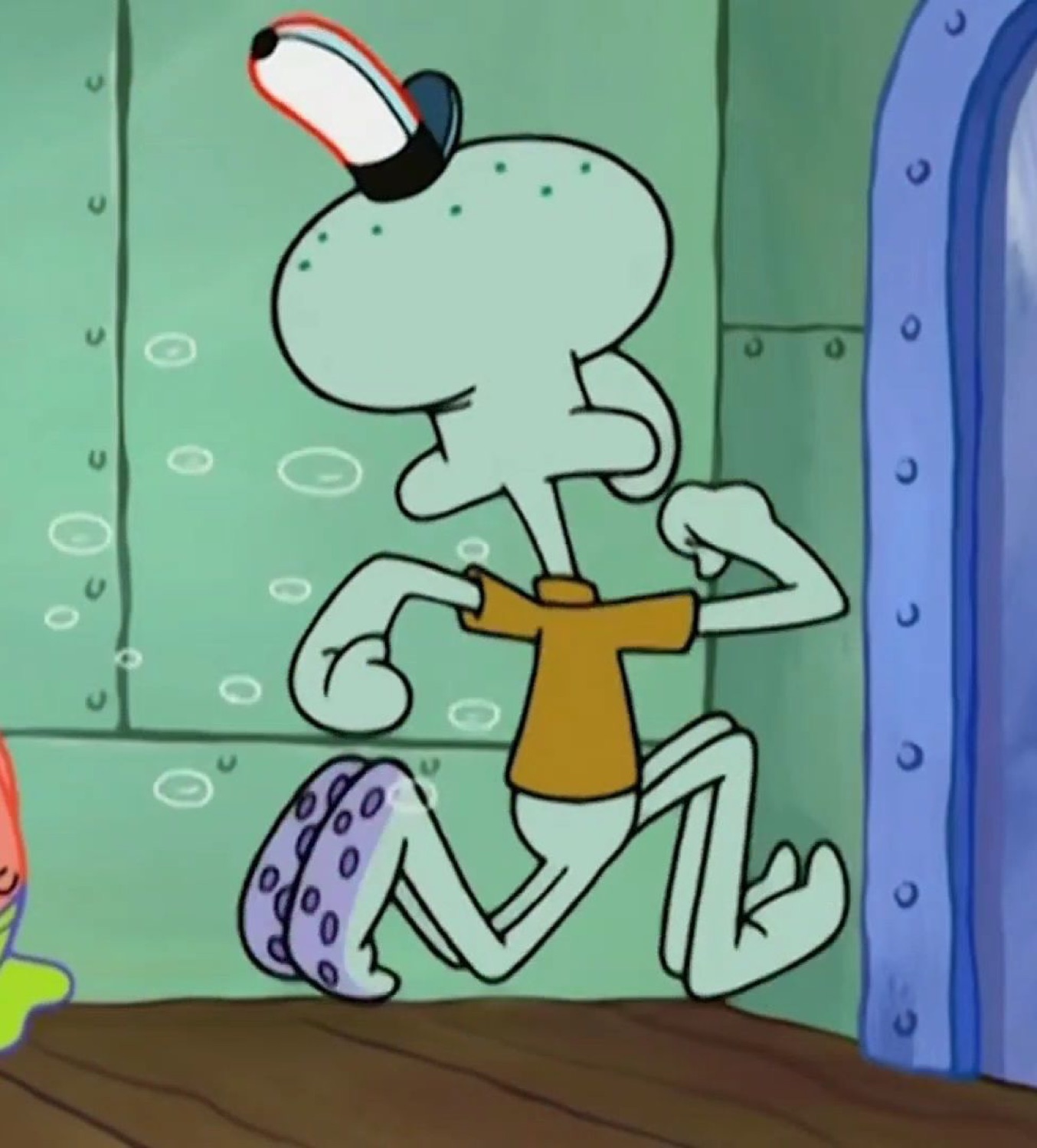 Squidward strutting confidently in a shirt and cap
