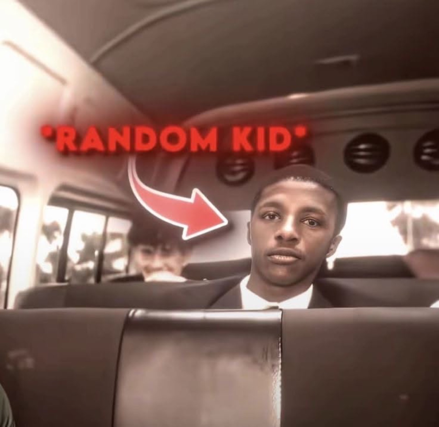 Young man on a bus with a completely flat, empty expression, labeled '*RANDOM KID*'