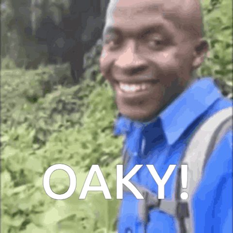 Smiling man with a backpack saying "Oaky!"