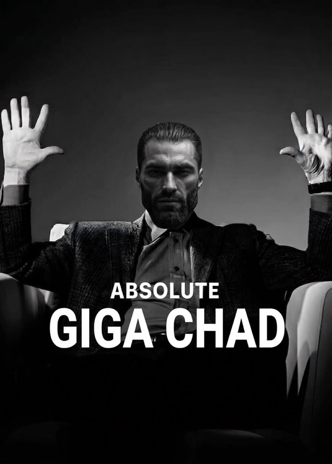 Man in a suit raising both hands in a dark theater: 'ABSOLUTE GIGA CHAD'