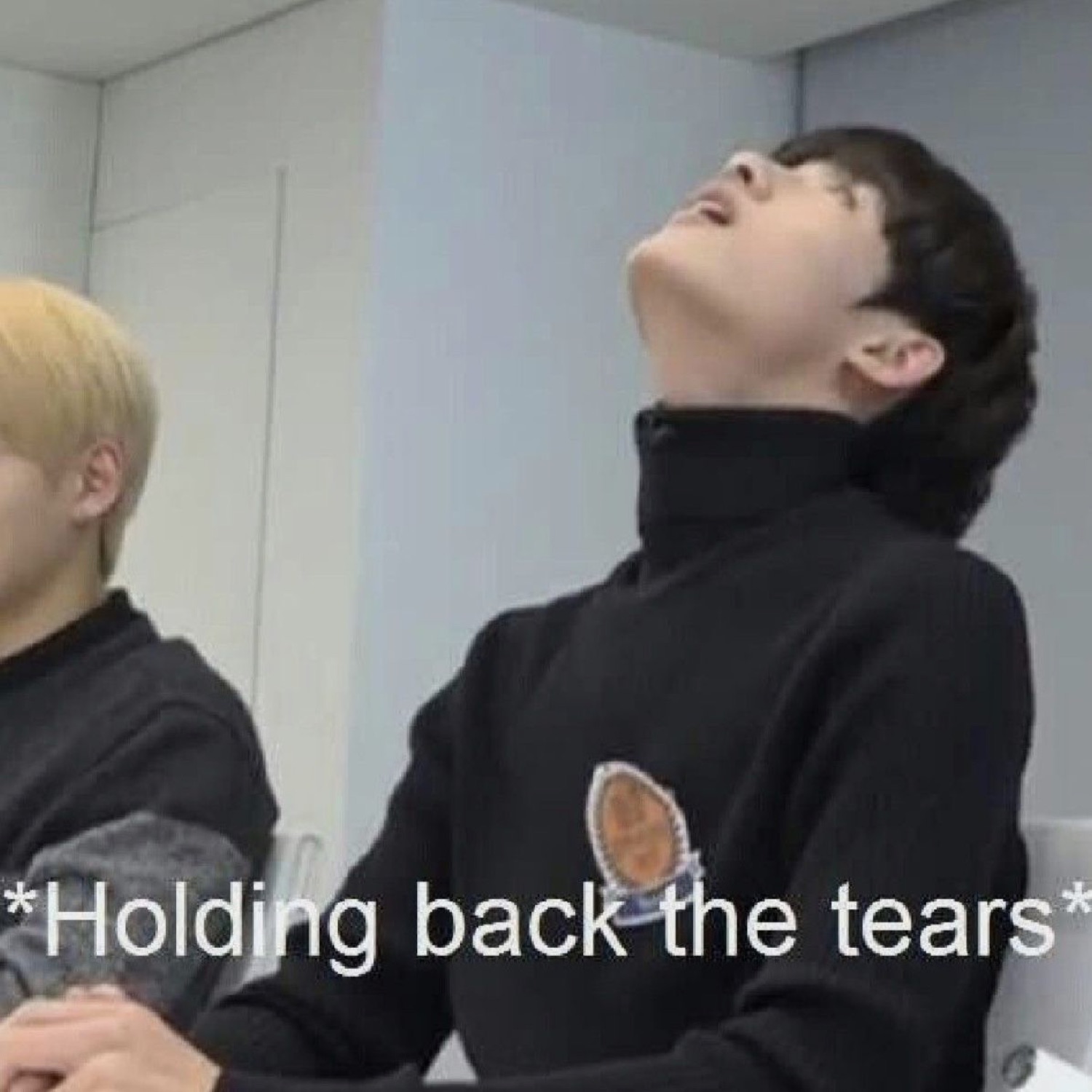 K-pop idol tilting head way back trying to hold it together, captioned '*Holding back the tears*'