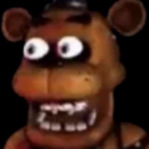 Freddy Fazbear staring dead ahead with wide googly eyes in the dark
