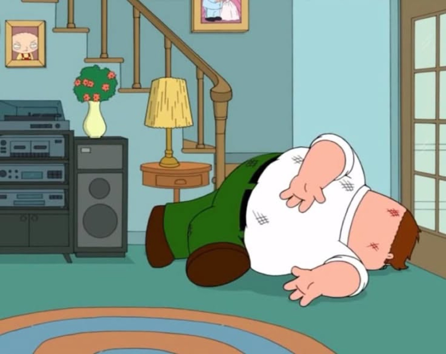 Peter Griffin lying face-down on the living room floor after a fall