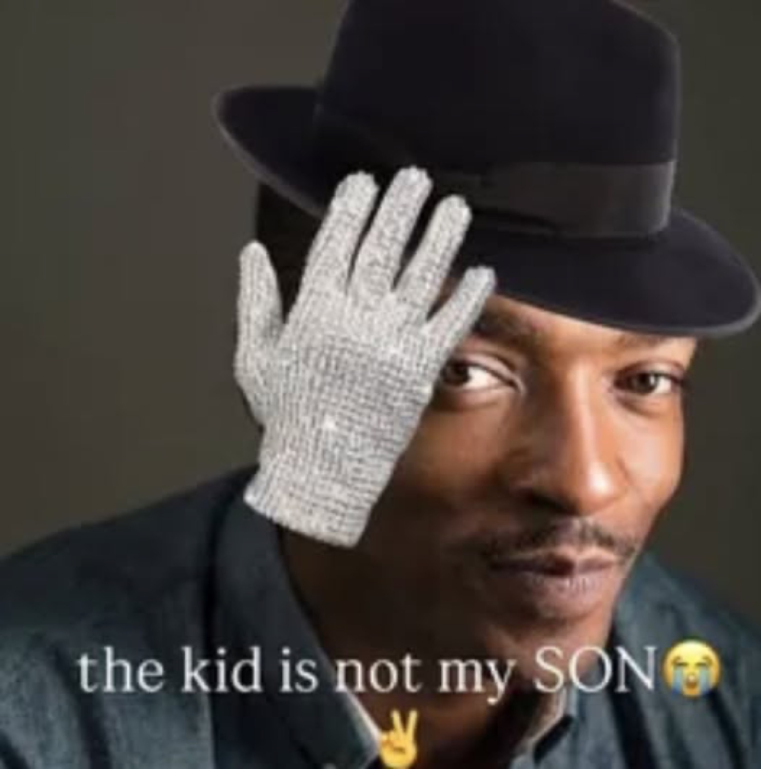 Man in a fedora and sequined glove doing a Michael Jackson pose, 'the kid is not my SON'