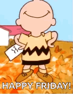 Charlie Brown smiling in a pile of autumn leaves, "Happy Friday!"