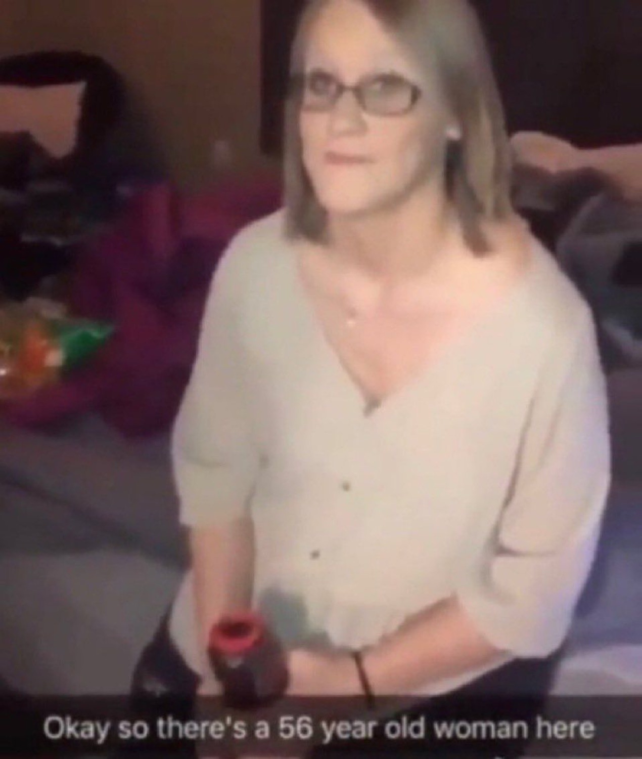 The original 'Okay so there's a 56 year old woman here' FaceApp snap: a woman in glasses and a cream cardigan staring blankly at the camera
