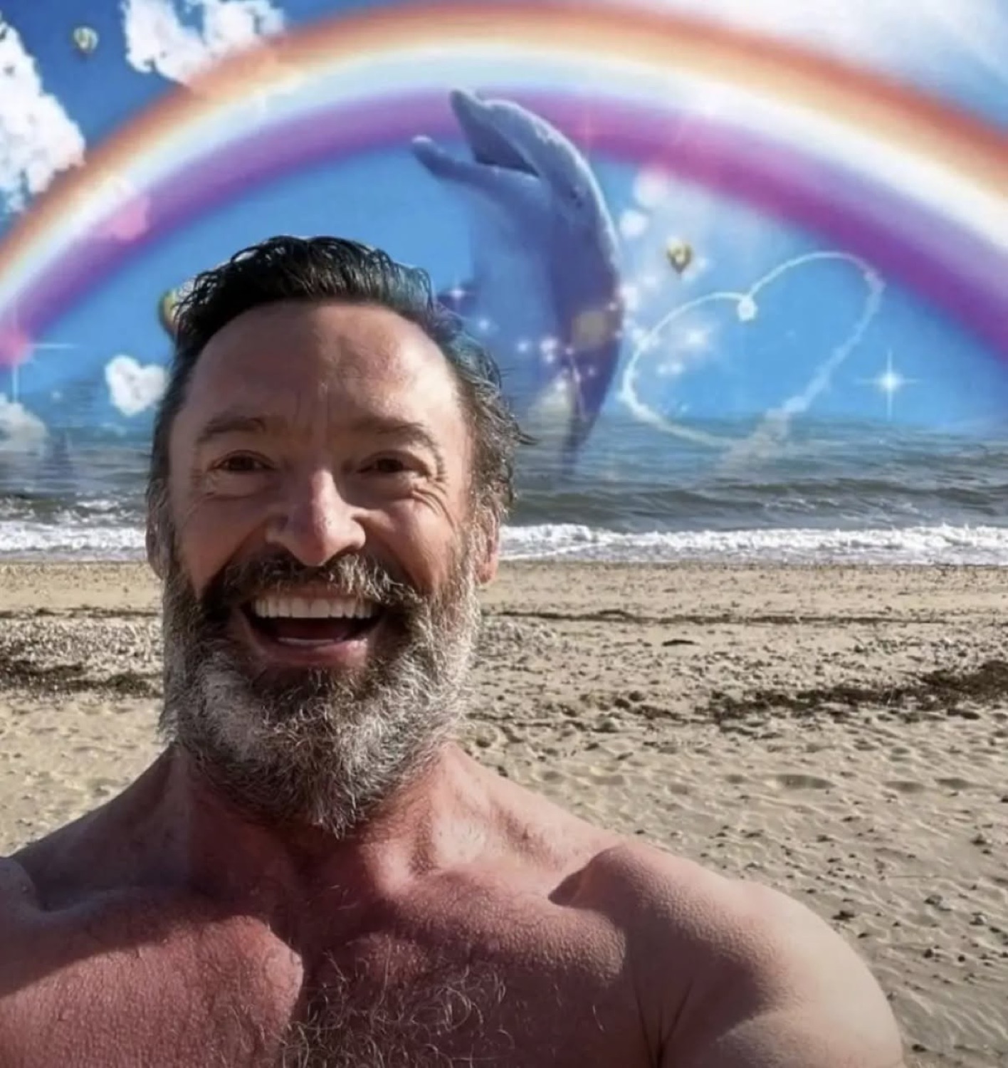 Shirtless bearded man beaming on a beach with a cartoon rainbow and dolphin behind him