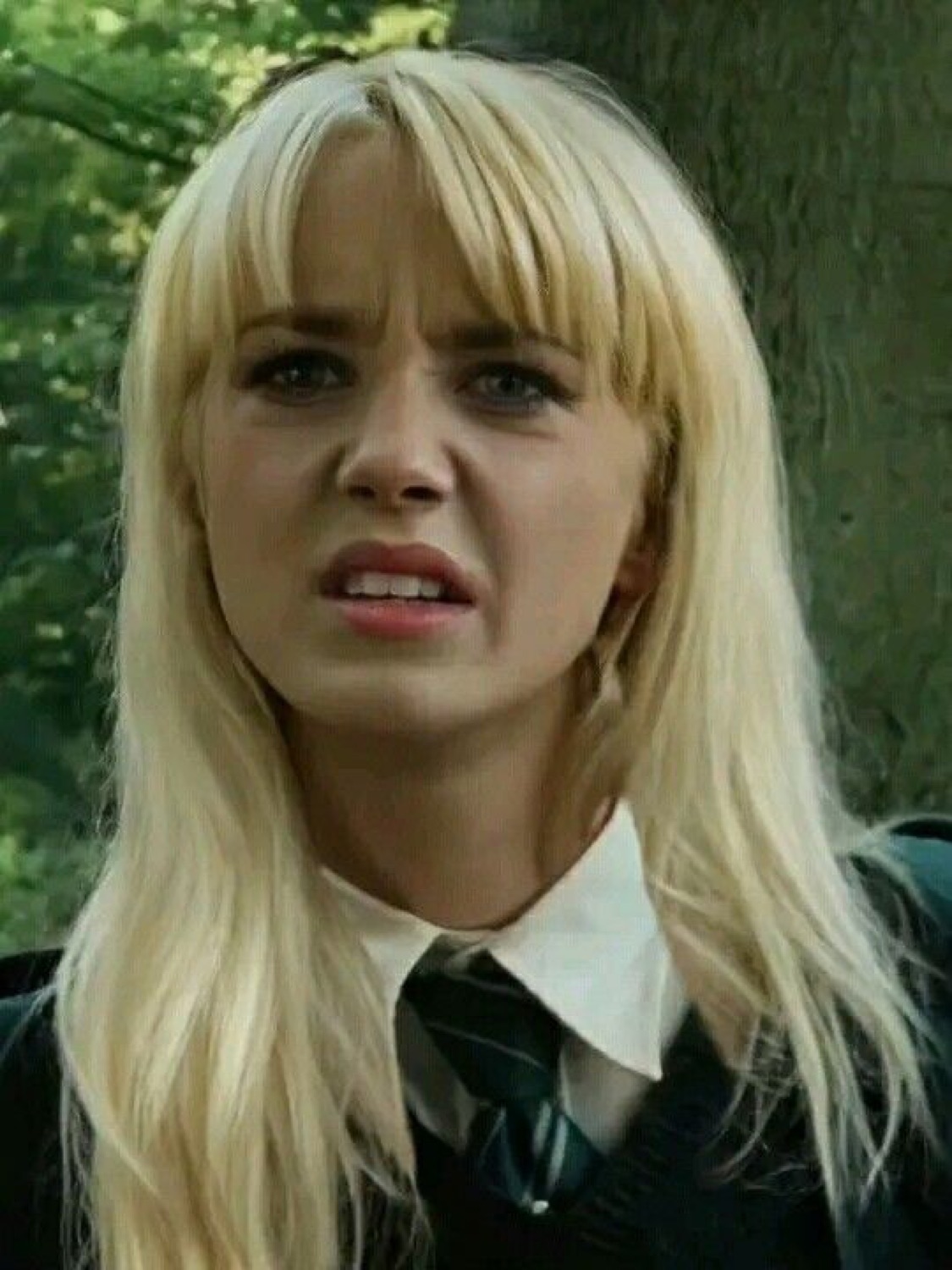 Malfoid, a gender-swapped Draco Malfoy with long blonde hair, grimacing in disgust