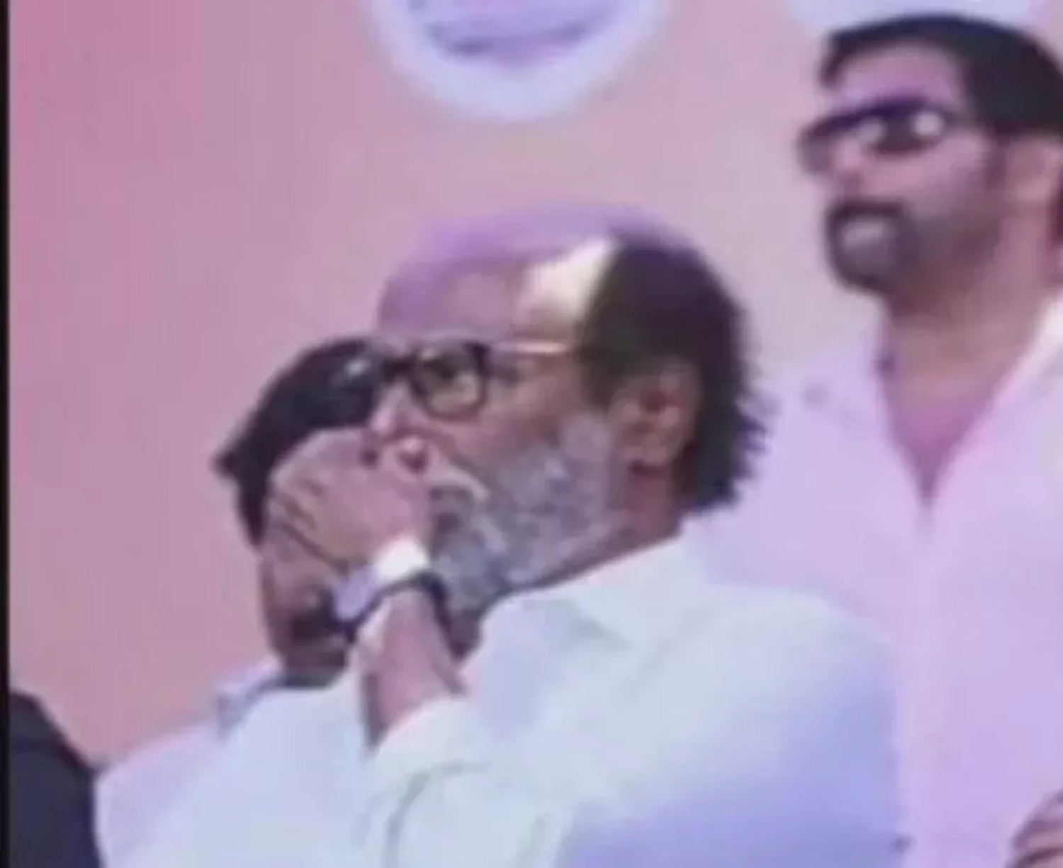 Rajinikanth covering his face in emotion