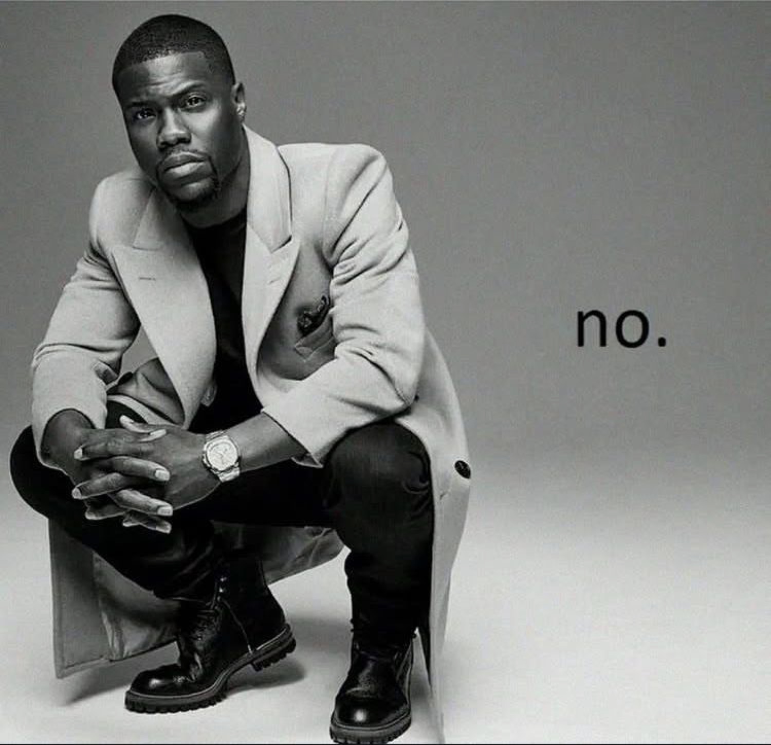 Kevin Hart crouching in a coat with a flat stare beside the word 'no.'