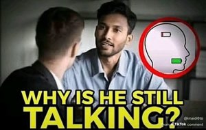 Man across a table looking drained with a near-dead battery icon over his head, captioned 'WHY IS HE STILL TALKING?'