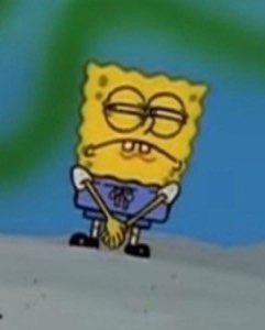 SpongeBob standing with arms crossed and droopy eyes, thoroughly fed up