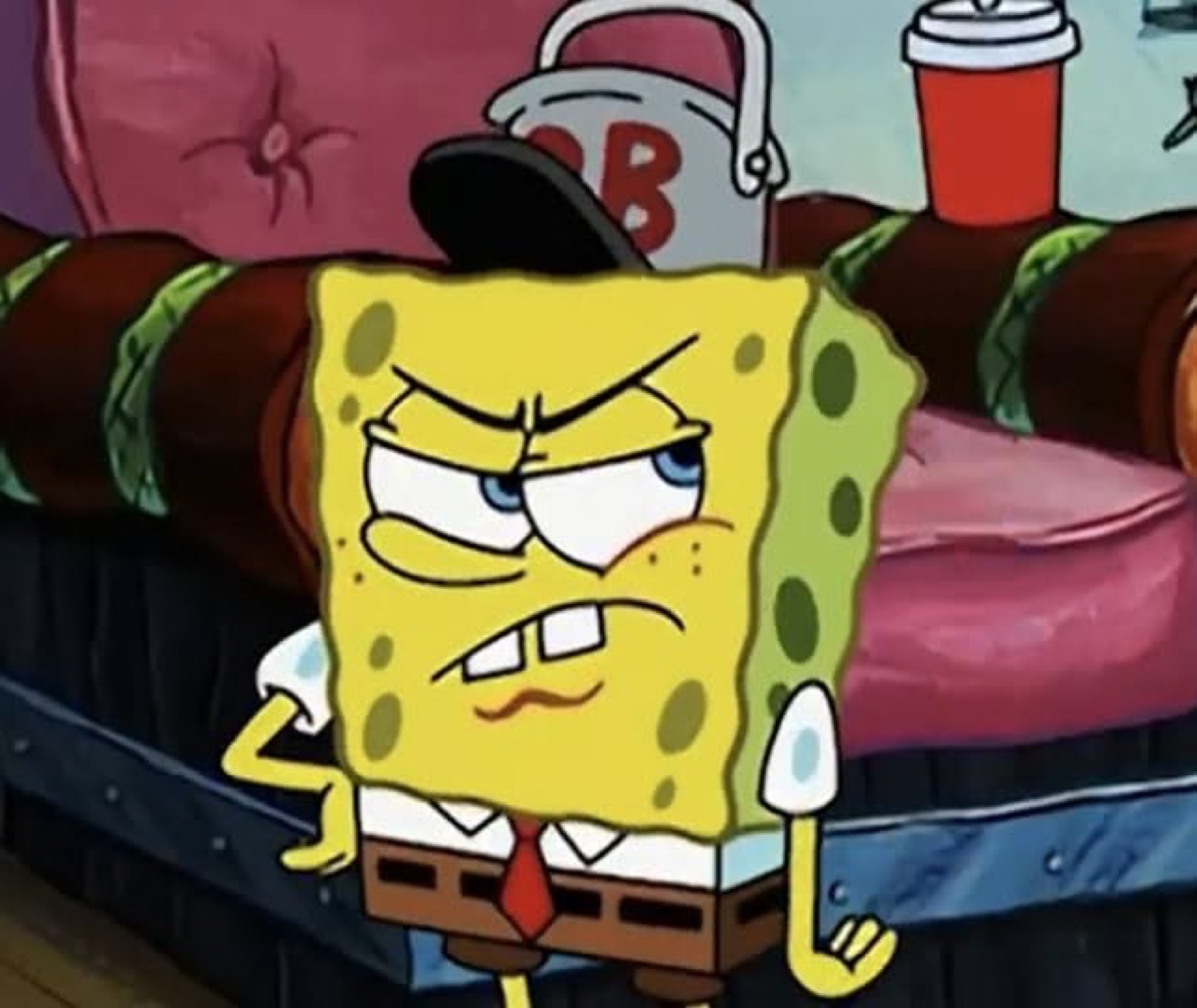 SpongeBob scowling with clenched teeth, visibly fed up