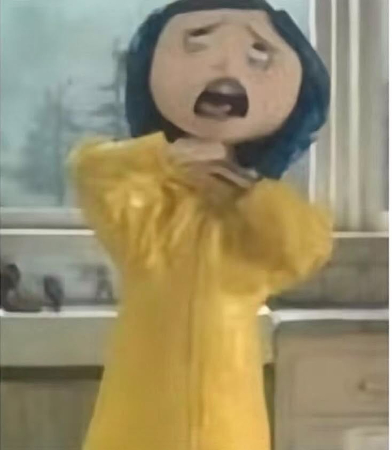 Coraline gagging in her yellow raincoat