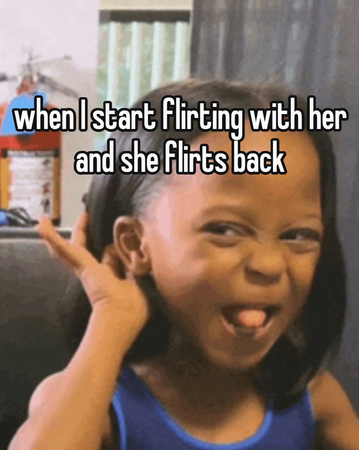 Little kid pulling a gleeful scrunched-up face, captioned 'when I start flirting with her and she flirts back'