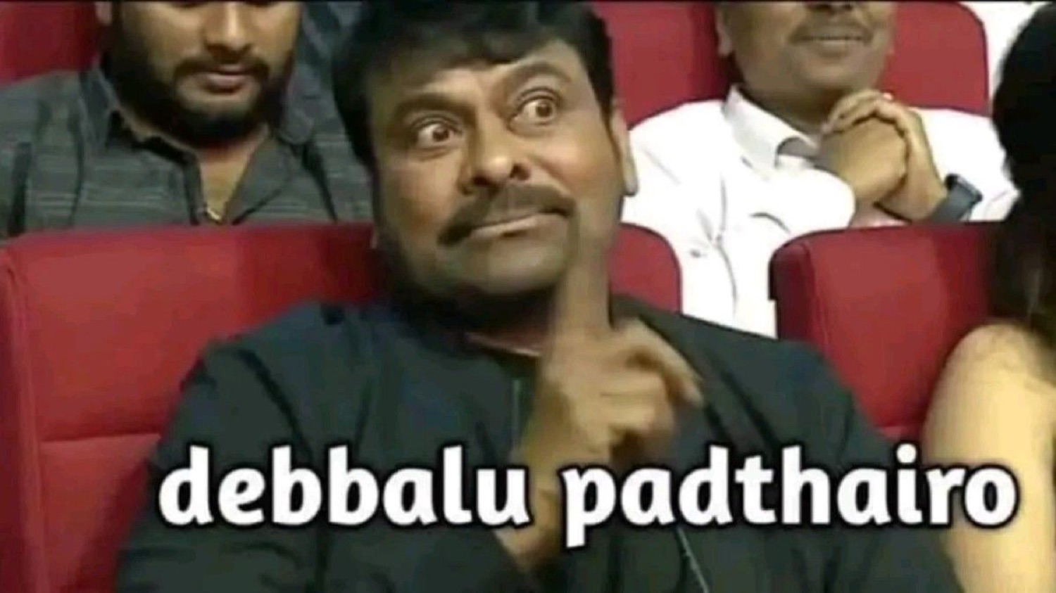 Chiranjeevi in a theater gesturing: 'debbalu padthairo' (you'll get a beating)