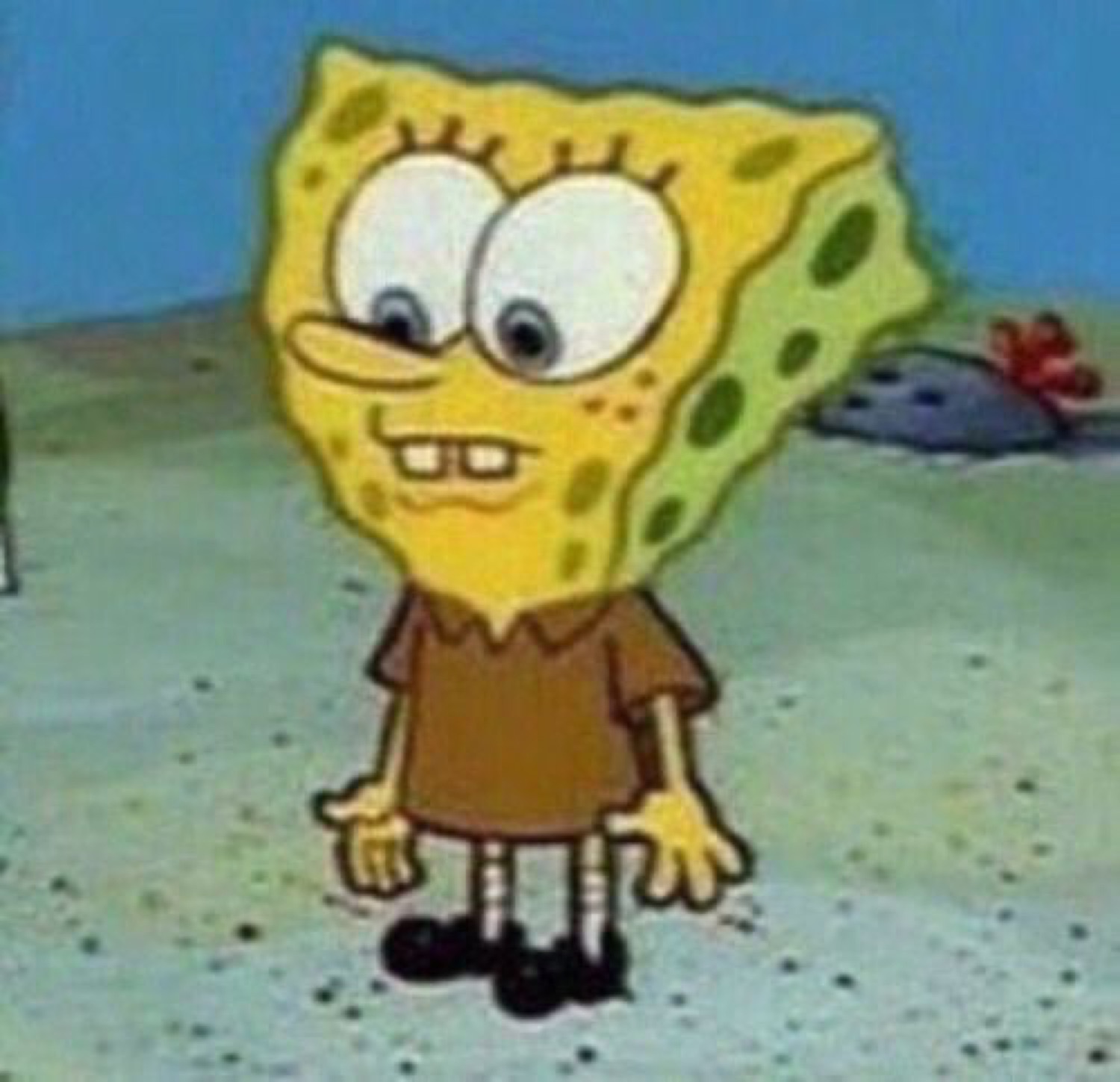 SpongeBob in a brown shirt standing with a slightly smug, buck-toothed grin