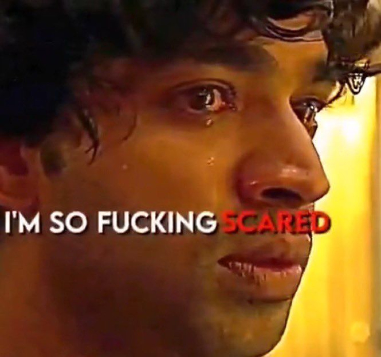 Close-up of a young man with a tear on his cheek and text declaring he's terrified