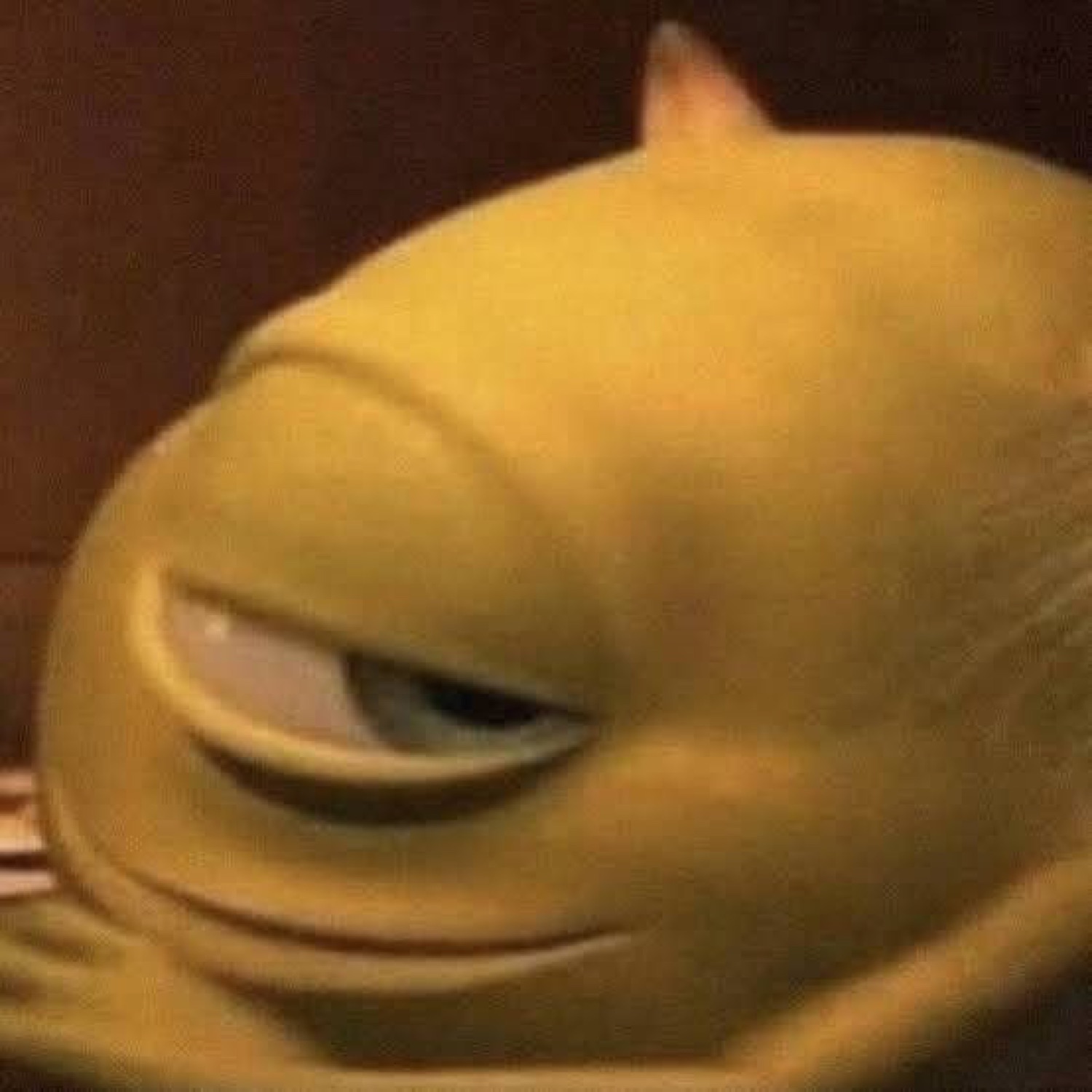 Yellow animated creature giving an extreme side-eye with half-lidded suspicion