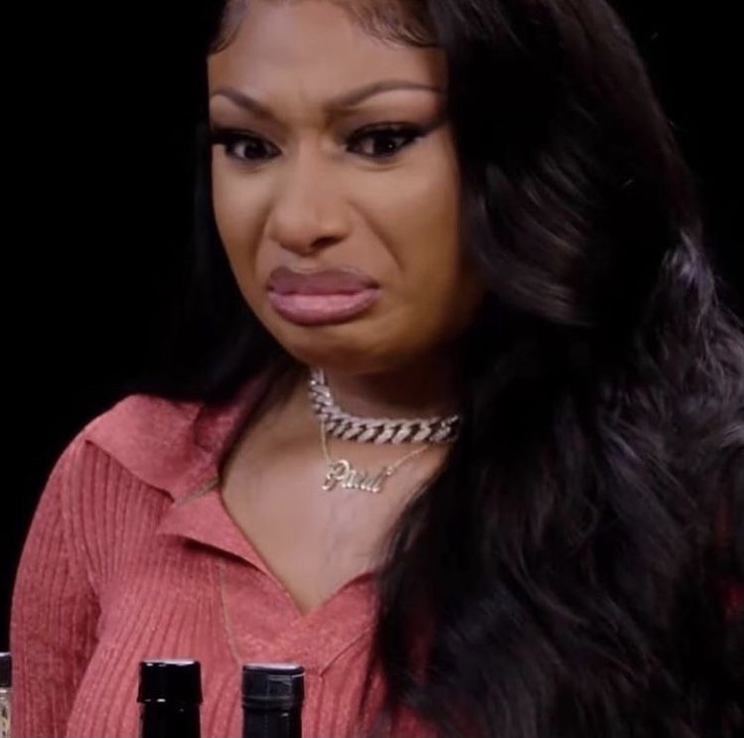 Megan Thee Stallion grimacing in disgust