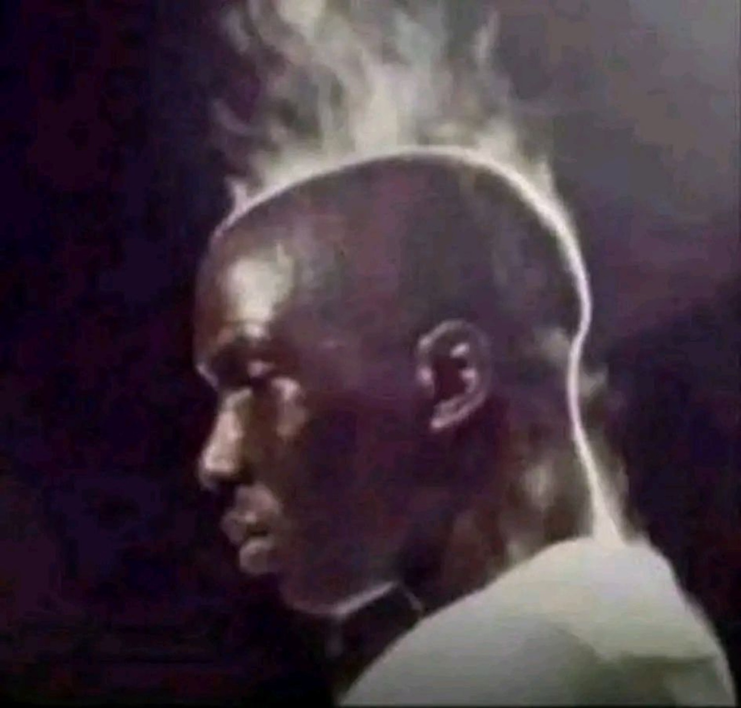 Profile of a man with steam rising off his head, looking calmly overheated