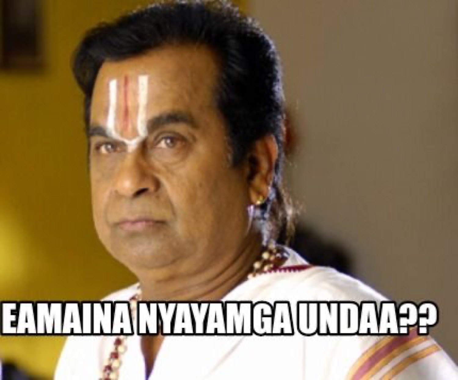 Brahmanandam with a tilak glaring: 'EAMAINA NYAYAMGA UNDAA??' (is this even fair??)