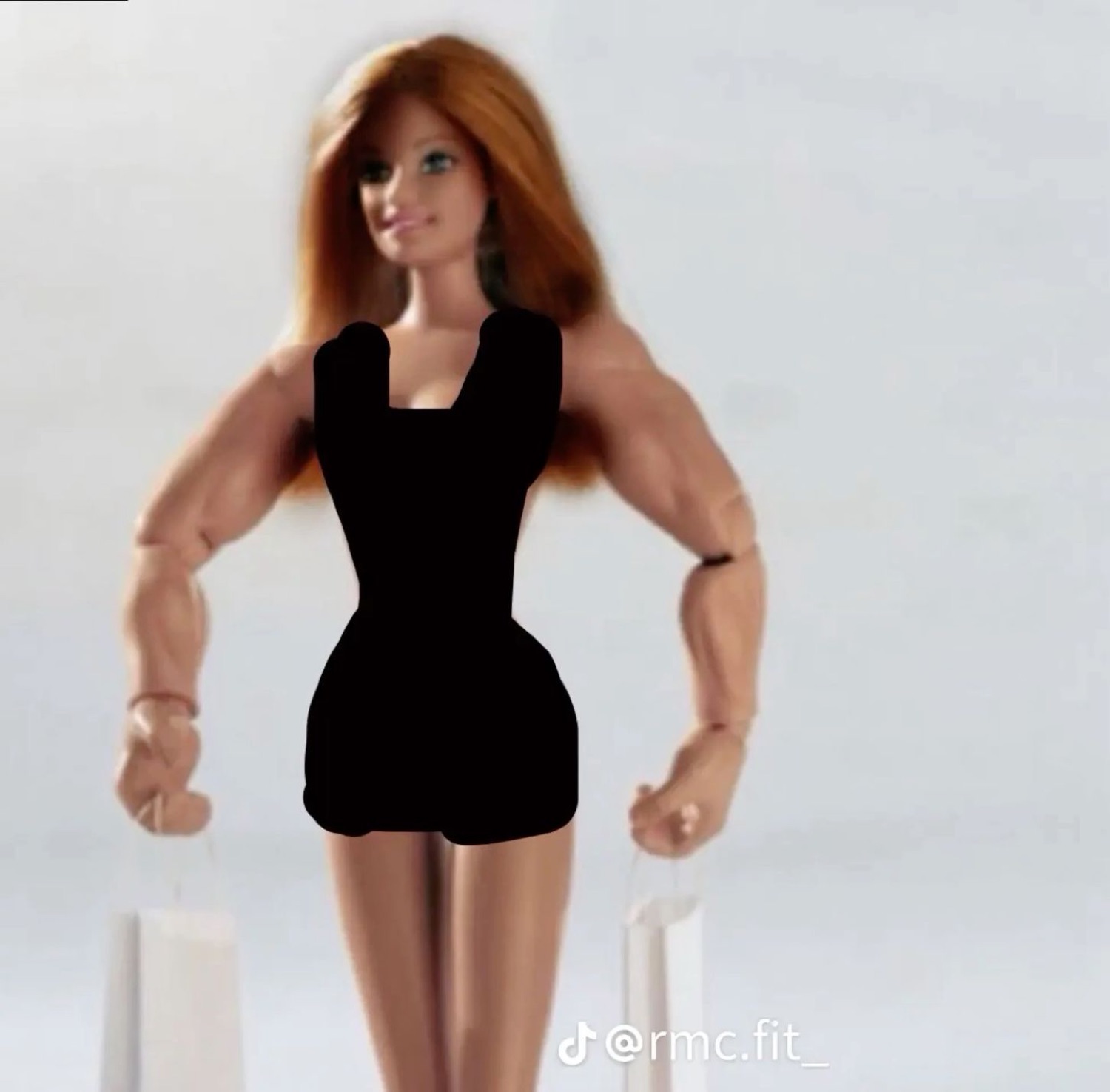 Barbie doll edited with huge muscular arms