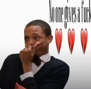 Man wiping his nose looking defeated next to 'No one gives a fuck' and broken hearts