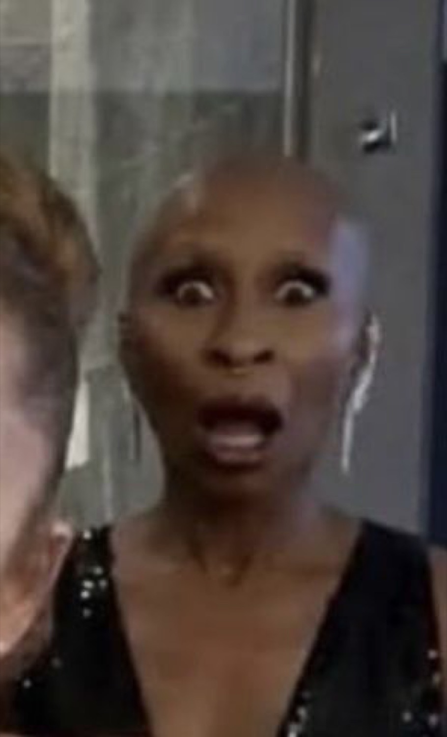 Woman with wide eyes and open mouth caught completely off guard