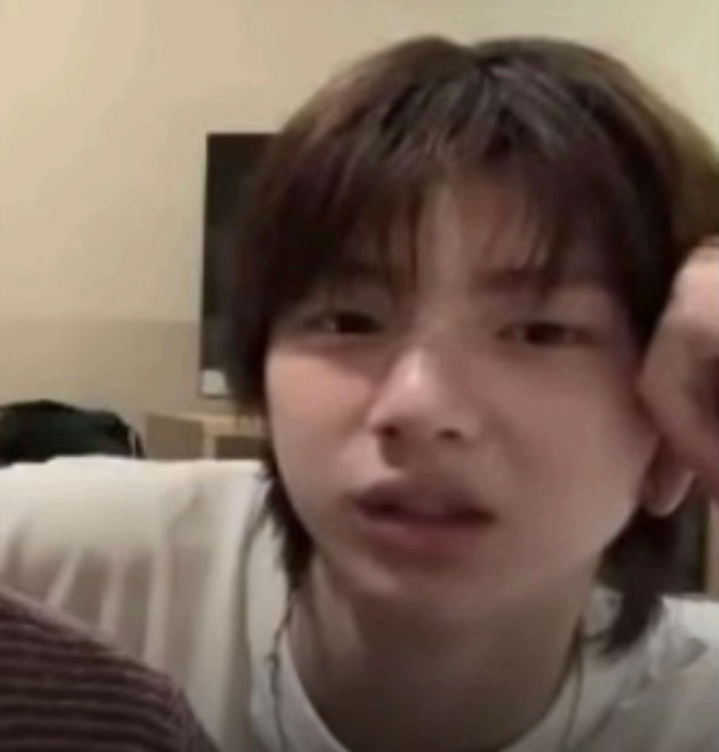 Young man looking dazed and slightly confused, mouth barely open
