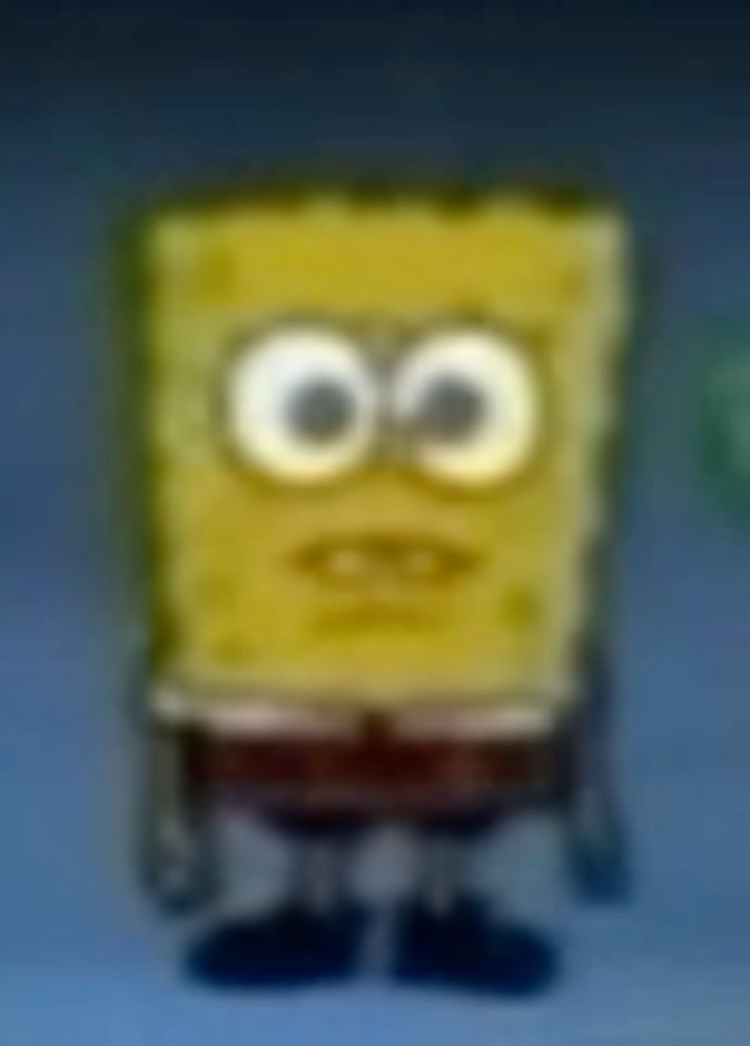 Blurry SpongeBob standing with a blank, wide-eyed stare