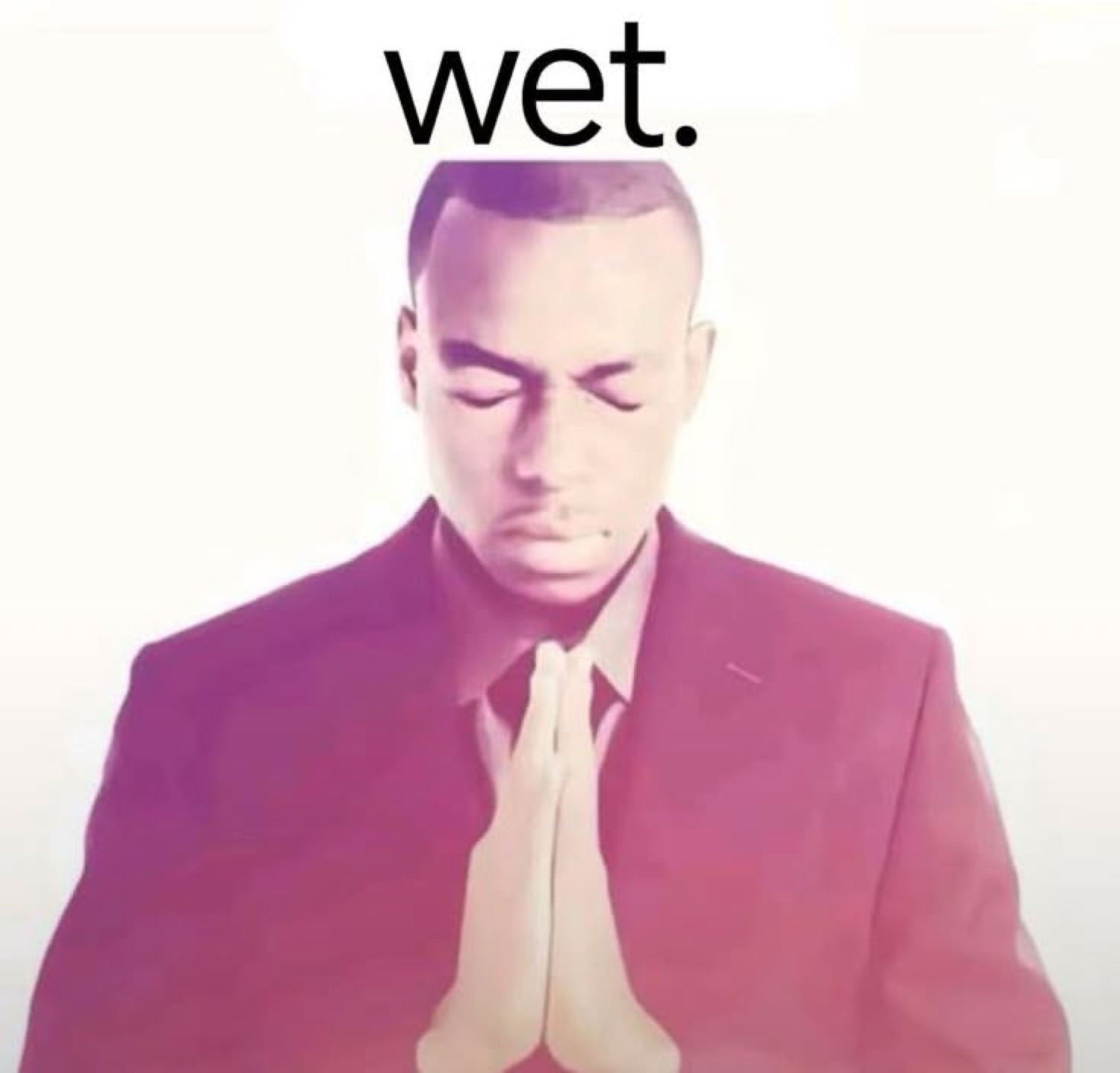 Man with eyes closed and hands pressed together in a prayer pose, captioned 'wet.'