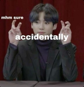 K-pop idol making air quotes with 'mhm sure' and 'accidentally' overlaid in knowing sarcasm