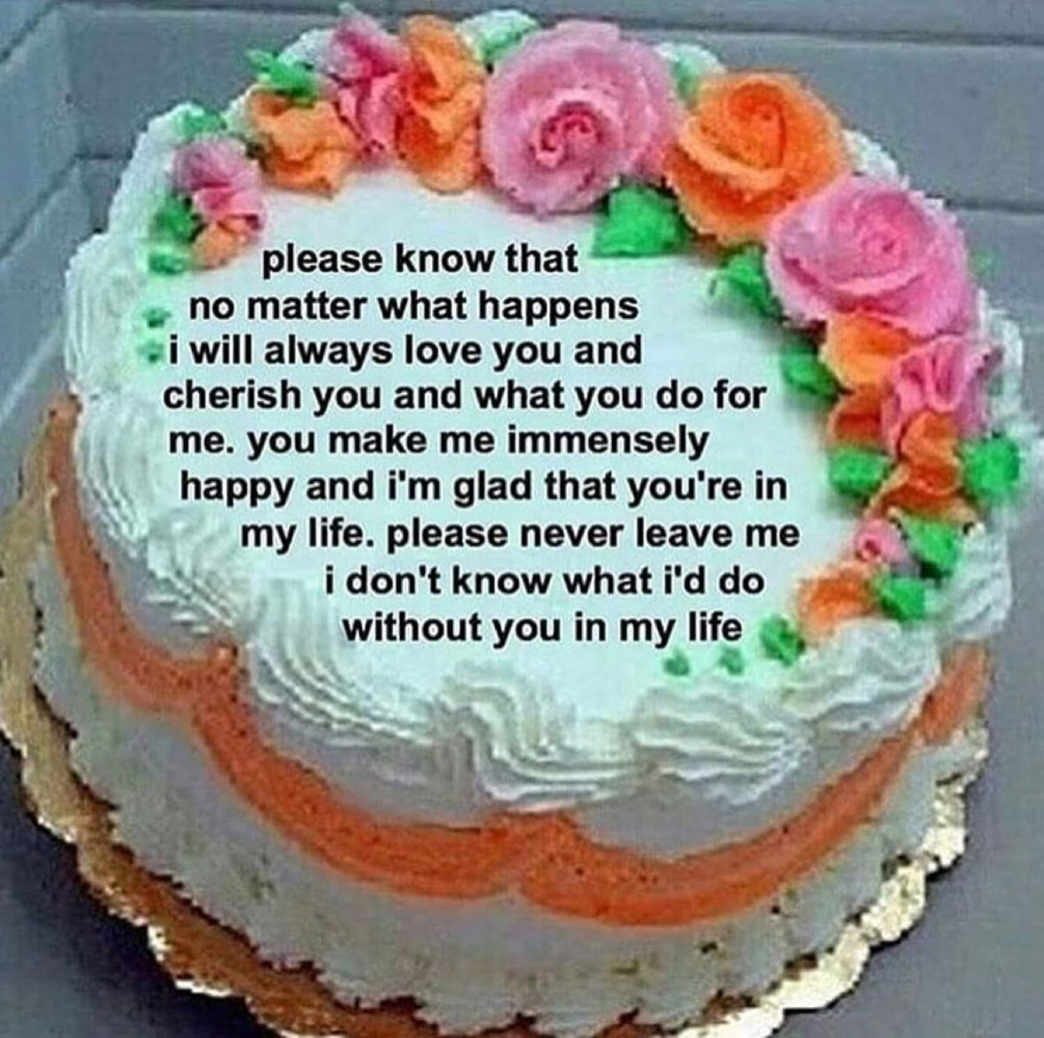 A flowery frosted cake carrying an intensely clingy 'please never leave me' love note