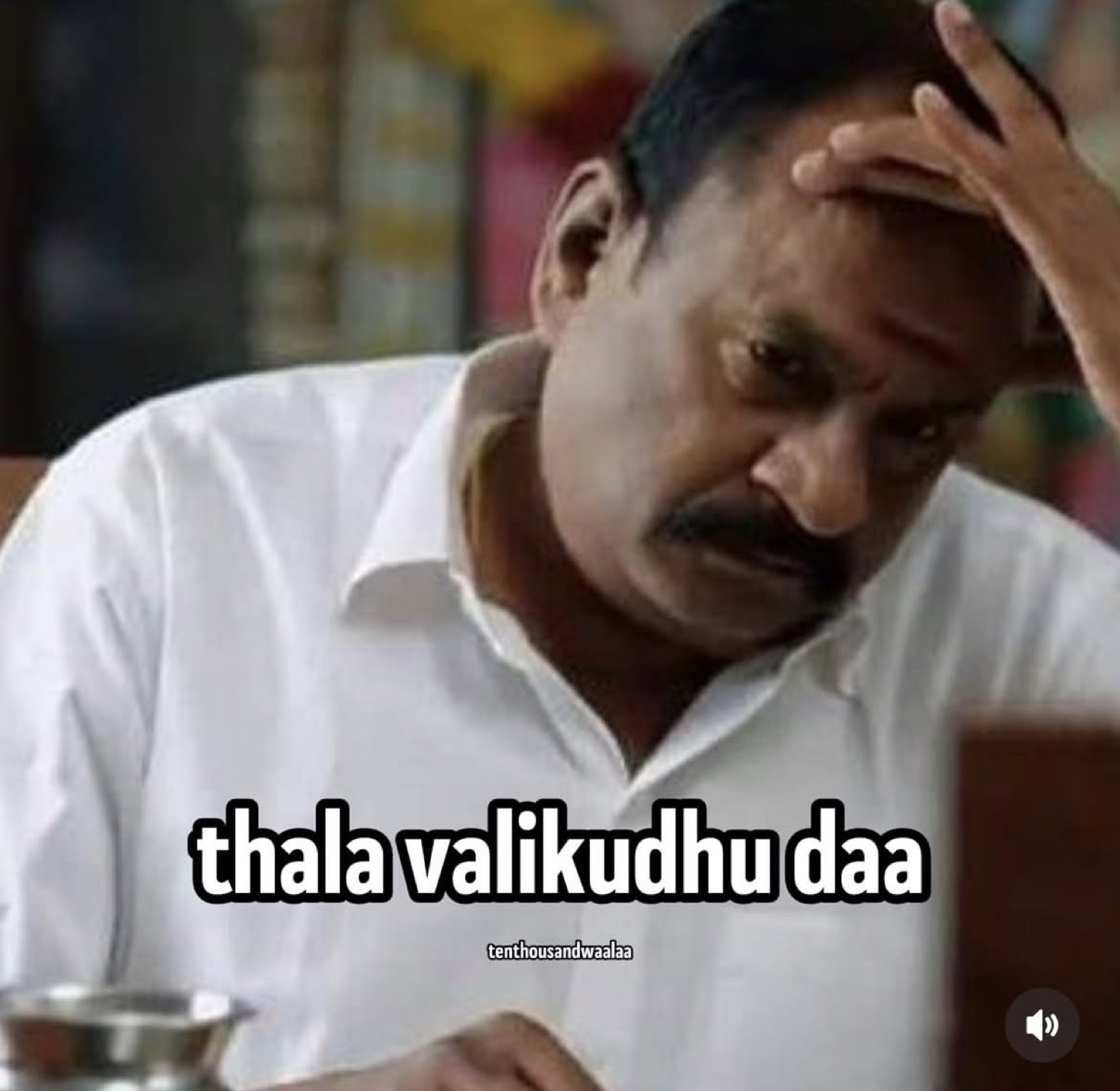 Man in white clutching his head: 'thala valikudhu daa' (my head hurts)