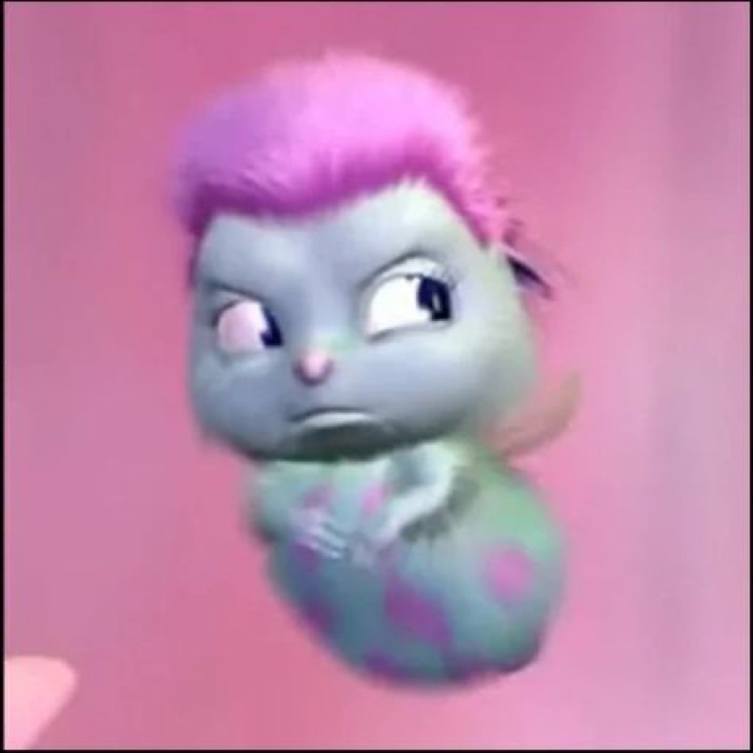 Tiny pink-haired CGI creature side-eyeing the camera with a grumpy frown