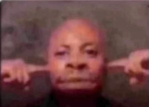 Grainy face pointing off to both sides with a flat, unamused expression