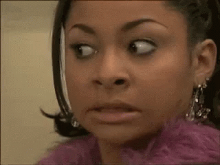 Raven-Symoné glancing sideways with a nervous look