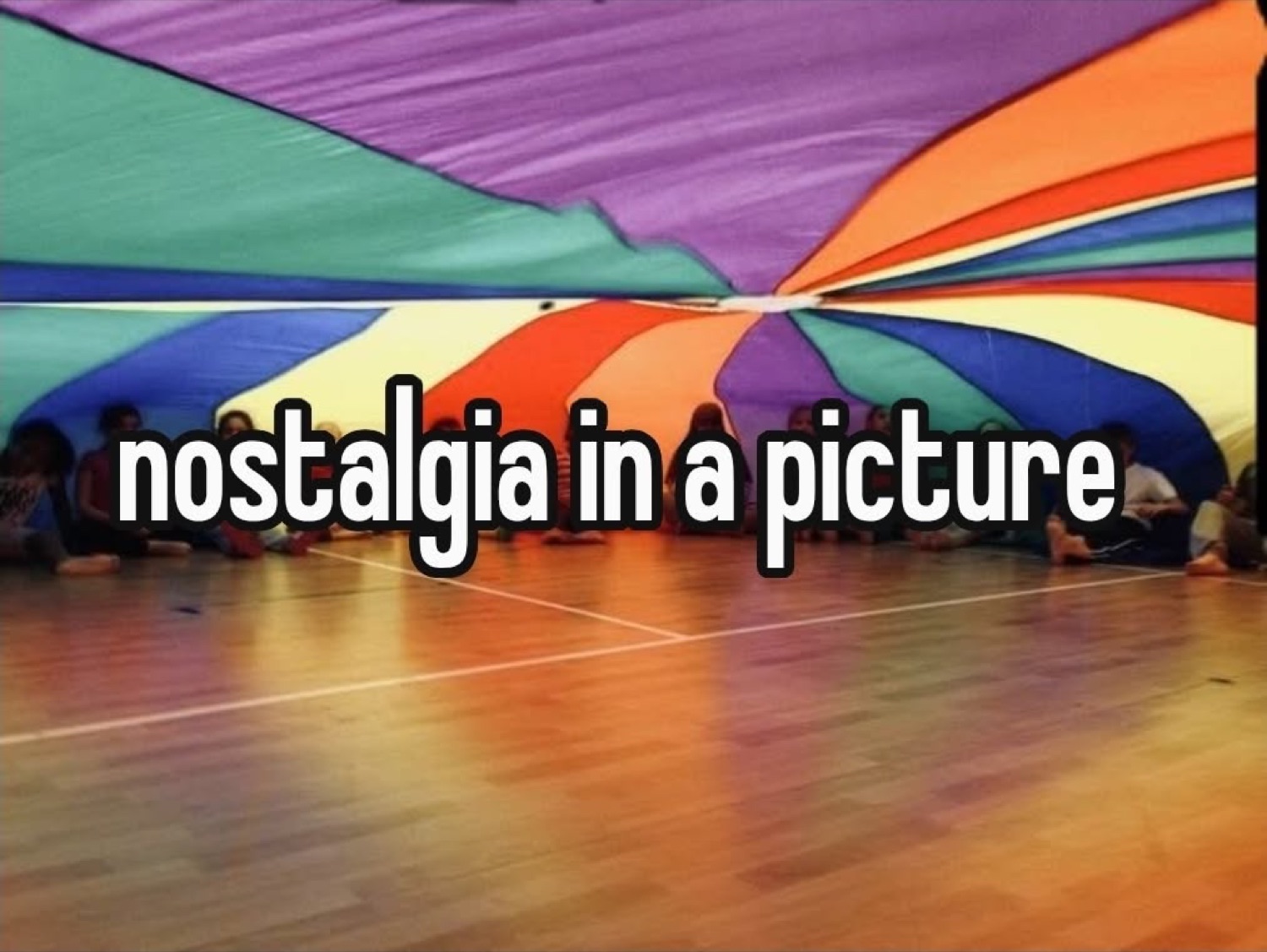 Rainbow play parachute in a gym: 'nostalgia in a picture'